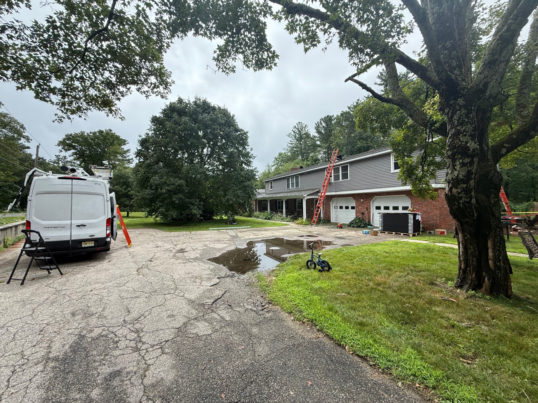 Solar installation in progress on a 5-unit rental property in Massachusetts by Apex Improvement Group